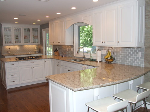 Cambria Windermere Kitchen Remodeling Ideas with All-White Cabinets, Smoke Glass Subway Tiles, Walnut Hardwood Flooring in U shape and Galley Shape Kitchen